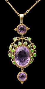 Jessie Marion King for Liberty & Co. Gold, enamel and amethyst pendant, c. 1900. H: 5.5 cm (2.17 in) W: 2.2 cm (0.87 in) British, c.1900 Fitted Case Minor repair to enamel Literature: cf. Liberty Jewellery sketch-book, page 290 Model number: 8603