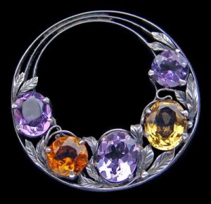 Bernard Instone. Arts and Crafts brooch. Silver, amethyst and citrine. Diameter: 4.1 cm (1.6 in). English, c. 1930. Sold by Tadema Gallery.