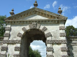 Green men on both sides of the two archway keystones.