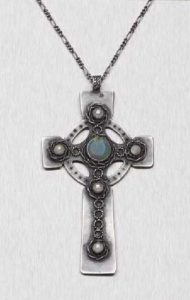 Mary Thew opal and pearl-decorated Celtic cross. No mention in the description if it was signed on the back. Sold in 2006 by Lyon and Turnbull.