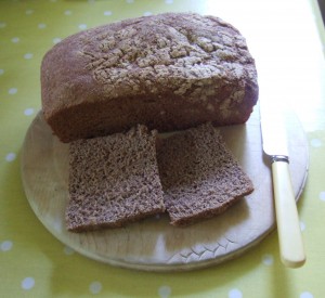 The finished bread. I had to cut the crust off the second loaf  (slices shown) as the nonstick finish in the loaf tin had stuck to the crust. Grrr! (Bad tin is now in the recycling bin).