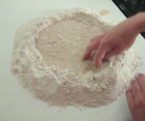 The well in the flour with the yeast and water mix added.