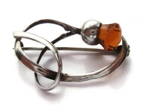 Thistle brooch by Charles Horner, silver and citrine glass.