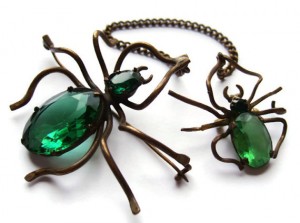 Two spider brooches joined by a safety chain. For sale in my Etsy shop.