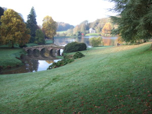 Stourhead. The Palladian Bridge in the foreground and the Pantheon on the other side of the lake.