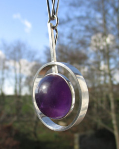 Another view of the NE From amethyst necklace. The cabochon is huge - 21 mm in diameter.