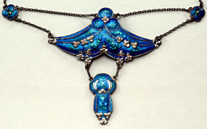 Jessie M King design: silver and enamel pendant necklace and chain, dating from 1905. Made for Liberty & Co, its design is in the Liberty Pattern Book, no 8809. In the collections of the National Museums of Scotland.