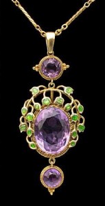 Jessie Marion King for Liberty & Co. Gold, enamel and amethyst pendant, c. 1900. H: 5.5 cm (2.17 in) W: 2.2 cm (0.87 in) British, c.1900 Fitted Case Minor repair to enamel Literature: cf. Liberty Jewellery sketch-book, page 290 Model number: 8603