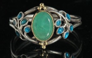 Jessie M. King for Liberty & Co. Ring, gold, silver, enamel and chrysoprase. Sold by Tadema Gallery. 