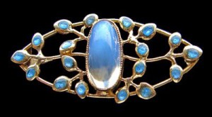 Jessie M King brooch design for Liberty & Co. Gold, moonstone and enamel. Liberty model number 1800. Sold by Tadema Gallery.