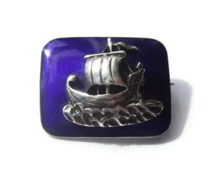 Tiny enamel and sterling silver Viking brooch. For sale in my Etsy shop: click on photos for details.