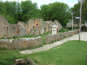 Row of four cottages. The village has been 'prettified' for the visitors: the pavement and kerbing postdate the village's abandonment.