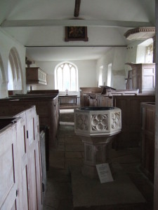 Looking from the west end towards the chancel. The font is a 19th century copy of a 15th century font.