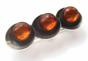 N E From Baltic amber moderist brooch. For sale in my Etsy shop: click on photo for details.