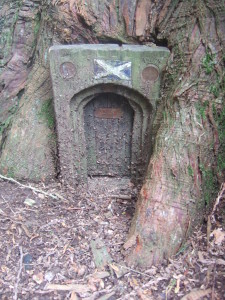 Scottish fairy door in a Western Red Cedar at the Larmer Tree Gardens.