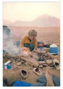 Hannah (or is it Ug the Cavewoman?) cooking on the camel shit fire, wadi Rum , 1985.