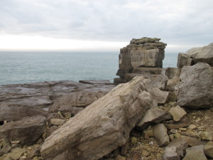 Dumped rejected stone near Pulpit Rock. The black dot on the water is a cormorant - we watched it repeatedly dive for food.