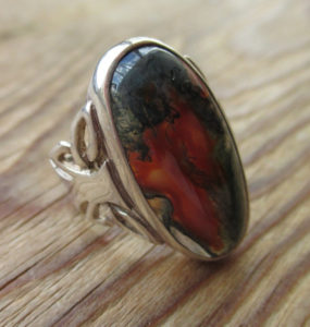 Oval moss agate ring, with a Celtic style sterling silver mount. 