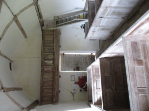 The view from the pulpit, with the wormy rood-loft gallery, and the nails bent over on the inside of the door.