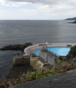 The Eddystone Lighthouse is just visible in theois photo, taken from above the Lido in Plymouth. The lighthouse is on the horizon, to the right of the light on the end of the breakwater. Click on photo to enlarge.