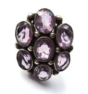 An amazing amethyst late Arts and Crafts ring, with seven magnificent amethysts. 